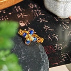 Rainbow Stone Inlaid Four-Leaf Clover B-Shaped Ring in Sapphire Blue Gradient